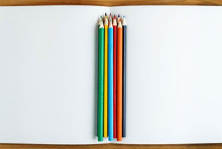 Album and colored pencils