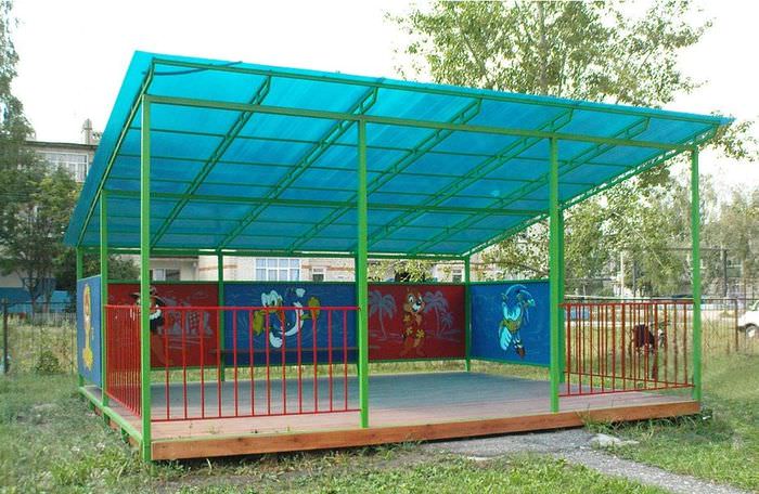 Large gazebo with a polycarbonate roof in a kindergarten