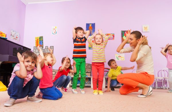 Children playing with teacher