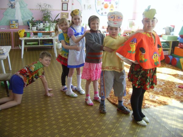 Children participate in a re-enactment of the fairy tale “Turnip”