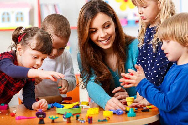 children study with a teacher