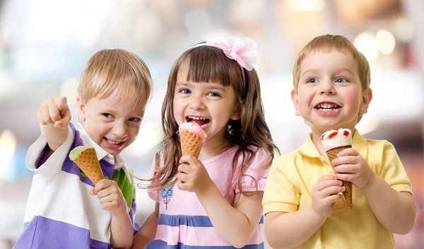 Children compete in eating ice cream