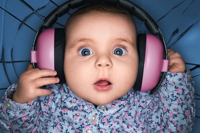 Baby wearing big headphones