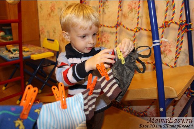 Playing with clothespins and drying clothes