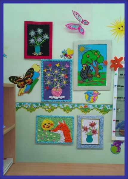 Children&#39;s works made in various techniques hang on the wall.