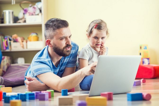 Child playing at the computer